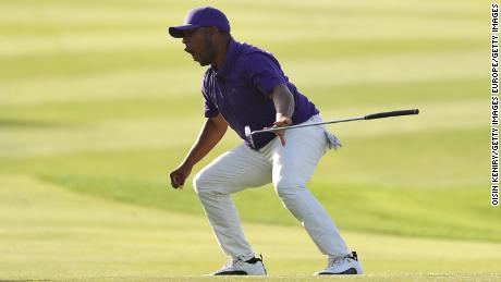 Harold Varner III celebrates after sinking an eagle putt on the 18th to win the Saudi International.
