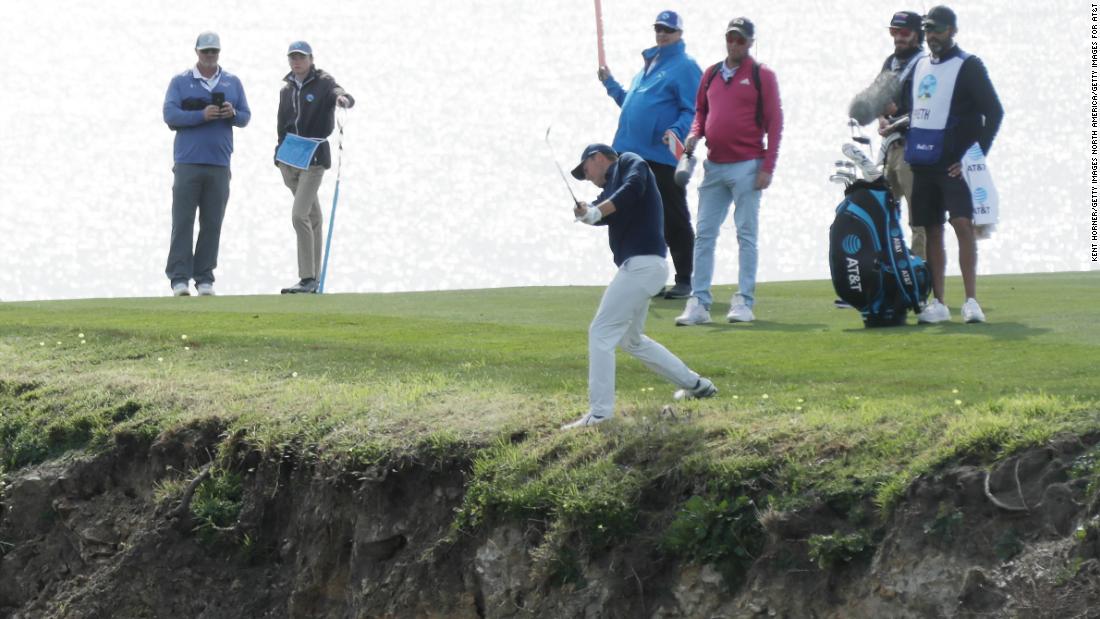 Spieth&#39;s drive on the par-four eighth hole had landed precariously near the edge of the cliff.