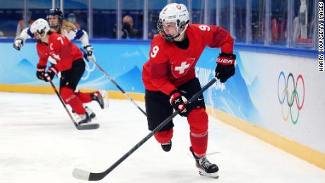 Switzerland&#39;s Shannon Sigrist skates with the puck against Finland during the second period of the women&#39;s preliminary round group A match at National Indoor Stadium on February 7 in Beijing.