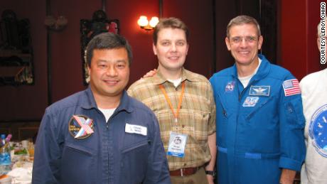 Astronaut Leroy Chiao (left) at a student event at Bauman Moscow State Technical University, with Victor Zelentsov and Bill McArthur, in July 2004.
