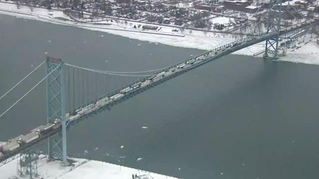 Canadian protesters block the busiest international crossing in North America as tensions ramp up over Covid-19 rules