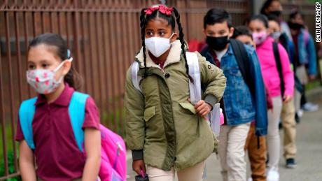 As states plan to lift school mask mandates, CDC remains vague on updating its guidance