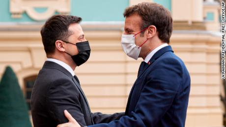 Diplomatic efforts to defuse the tensions around Ukraine continued on Tuesday with Emmanuel Macron, right, arriving in Kyiv for talks with Ukraine&#39;s president.