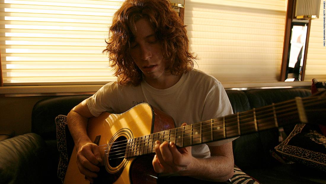 White plays the guitar on a tour bus while attending the X Games in 2006.