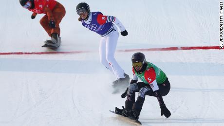 Jacobellis crosses the finish line to win the gold medal during the women&#39;s snowboard cross big final.
