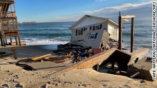 A home collapsed into the ocean as rising seas eat away at the North Carolina coast