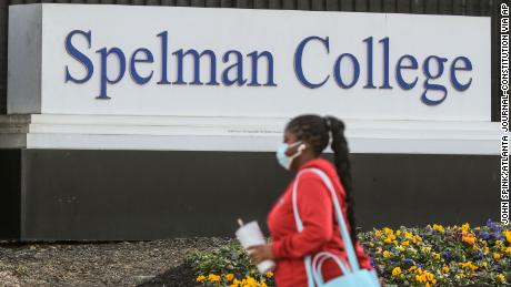 A woman walks outside the Spelman campus last week after two historically Black colleges in Georgia received bomb threats, a disturbing trend that many HBCUs across the country have been threatened with in recent weeks.