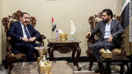 Hoshyar Zebari (L), leader of Iraq&#39;s Kurdish delegation to post-election negotiations, meets Hassan al-Adari, head of the political body of the Sadrist bloc, in Baghdad on November 5. 
