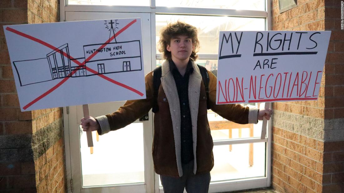 High school students stage a walkout after they say they were forced to attend a Christian revival assembly during school hours