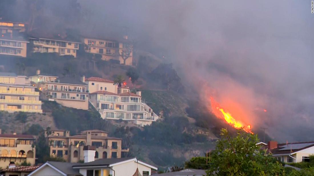Brush fire threatens homes and prompts evacuation orders in Laguna Beach California – CNN