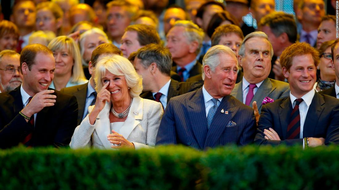 The couple shares a laugh with Prince William, left, and Prince Harry during the opening ceremony of the Invictus Games in September 2014.