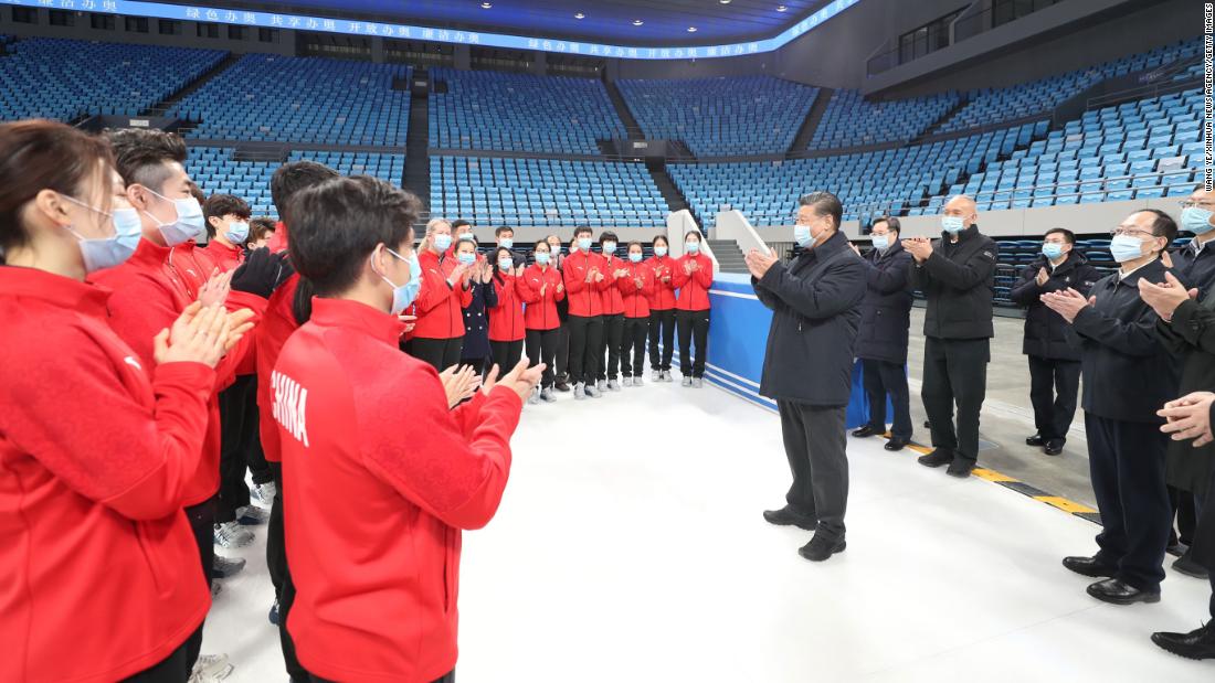 Chinese President Xi Jinping talks with athletes and coaches while visiting the Capital Gymnasium in Haidian District, Beijing in January, 2021.