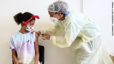 Sarah Santos Costa receives a dose of the Pfizer Covid-19 vaccine on January 17, 2022, as part of the first group of children under 12 to get the vaccine.
