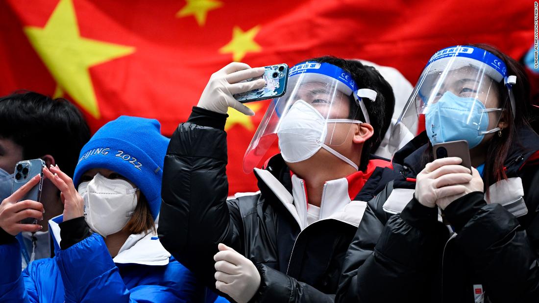 Fans celebrate after China&#39;s Yan Wengang won bronze in the men&#39;s skeleton event on February 11.