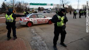 Canadian police attempt to clear protesters blocking Ambassador Bridge to US