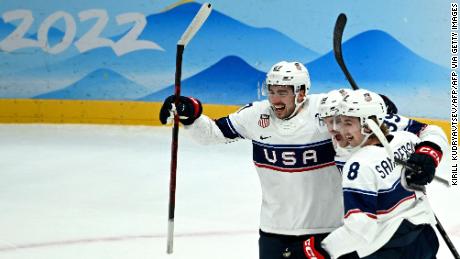 USA&#39;s players celebrate scoring against Canada. 