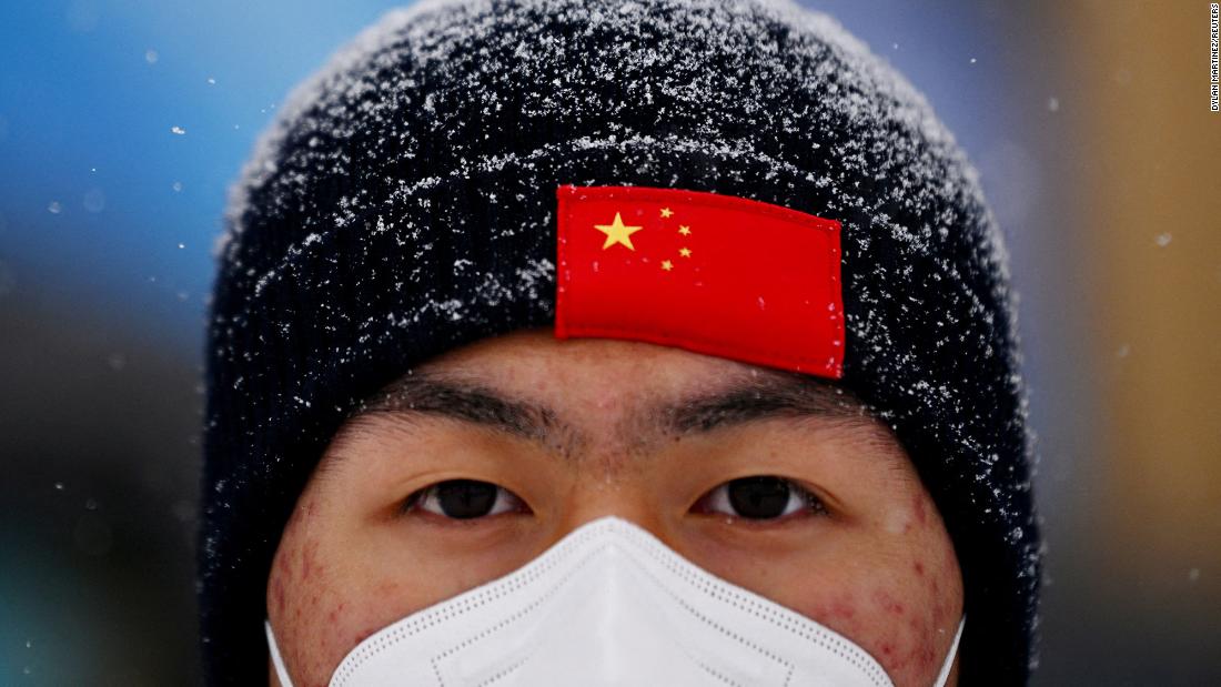 A man attends a freestyle skiing event that was postponed because of &lt;a href=&quot;https://www.cnn.com/world/live-news/beijing-winter-olympics-02-13-22-spt/h_79912fabddc27a4d4b7d201f61fd125a&quot; target=&quot;_blank&quot;&gt;poor weather conditions.&lt;/a&gt;
