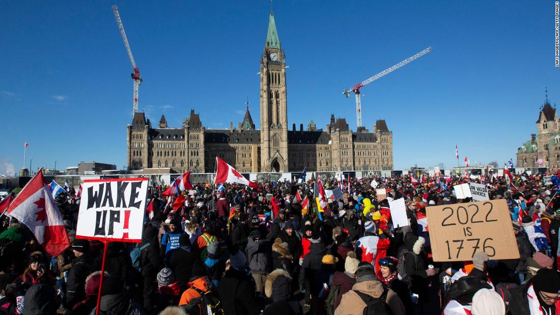 Supporters arrive at Parliament Hill to protest on January 29. Hundreds of truckers drove their giant rigs into the Canadian capital.