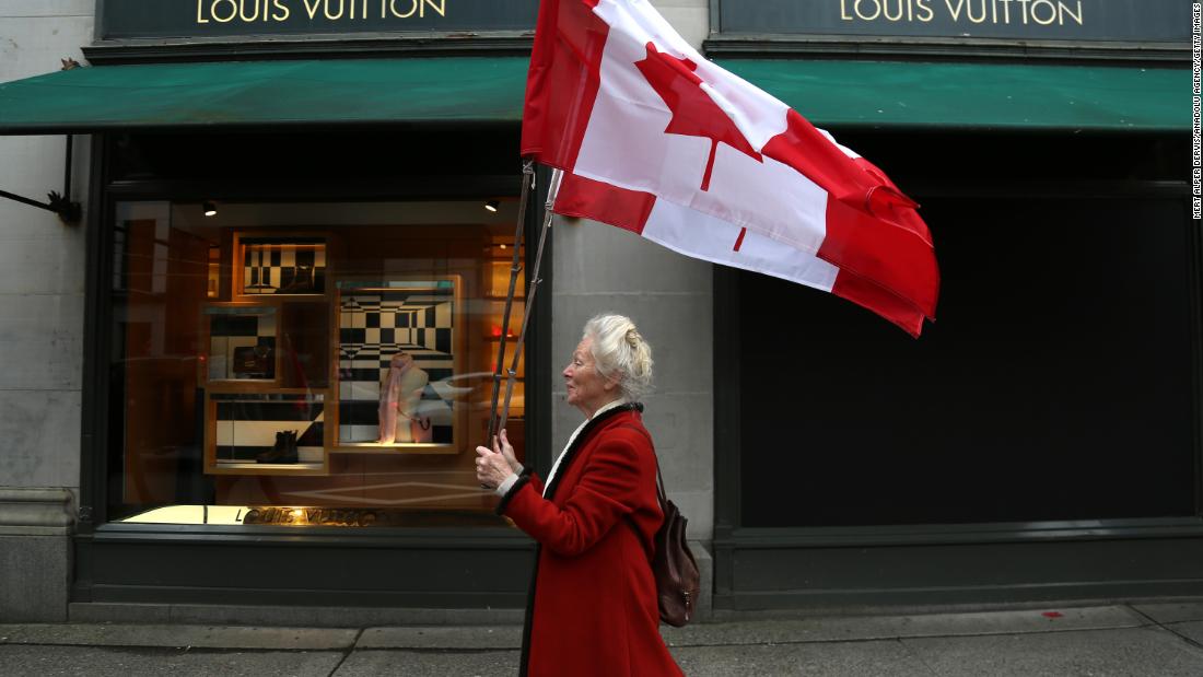 A protester walks to a demonstration in Vancouver, British Columbia, on February 5.