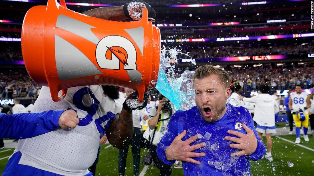 Rams defensive end A&#39;Shawn Robinson pours Gatorade over McVay.