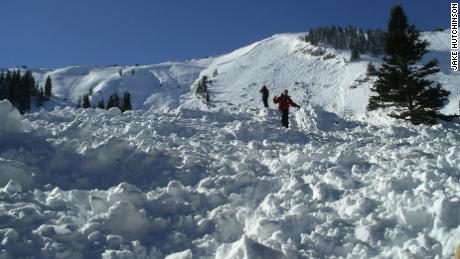 Rescuers working Dutch Draw avalanche in 2004 debris field, search for visual clues of people buried.