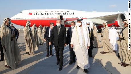 Turkish President Recep Tayyip Erdogan (L) is welcomed by Emirati officials after arriving at Abu Dhabi&#39;s international airport Monday. 