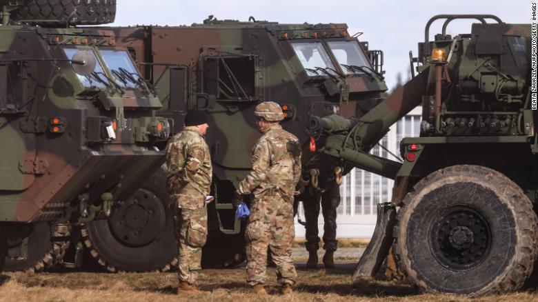 US soldiers and military vehicles are seen at a military airport in Mielec, Poland, on Saturday, February 12. The White House approved a plan for the nearly 2,000 US troops in Poland <a href="https://www.cnn.com/2022/02/09/politics/white-house-plan-troops-help-americans-leave-ukraine/index.html" target="_blank">to help Americans who may try to evacuate Ukraine</a> if Russia invades, according to two US officials familiar with the matter.