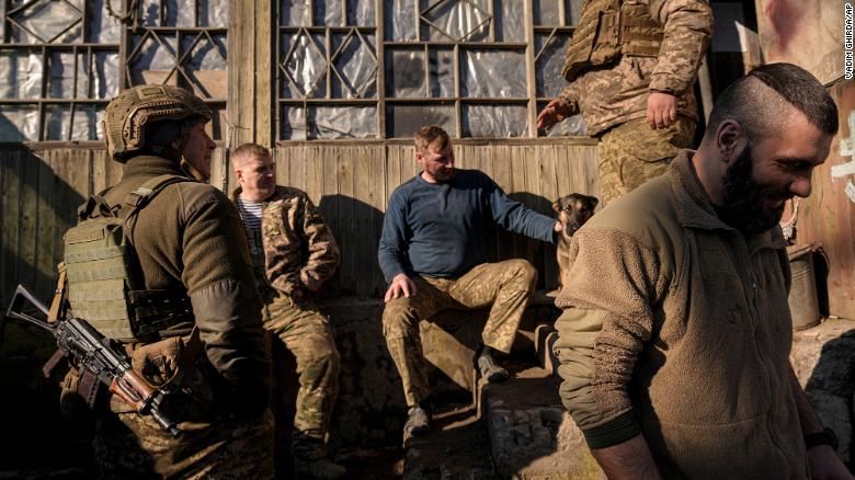 Ukrainian service members talk at a front-line position in eastern Ukraine on February 14. 