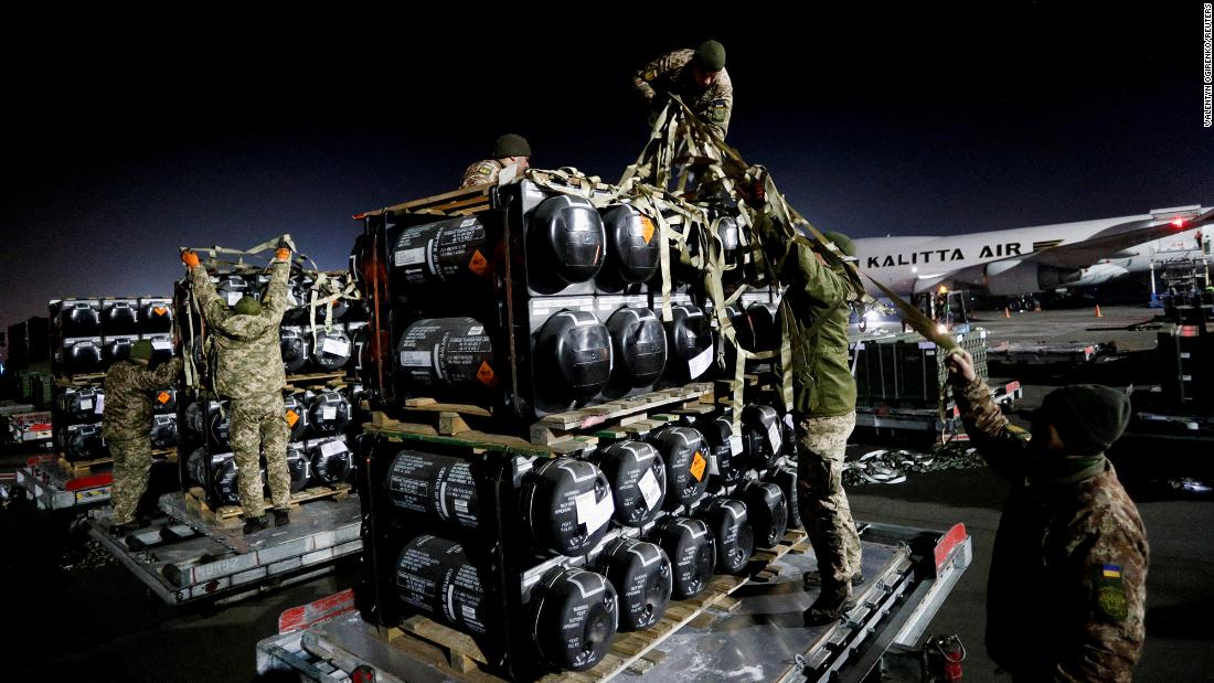 Ukrainian service members unpack Javelin anti-tank missiles that were delivered to Kyiv on Thursday, February 10, as part of a US military support package for Ukraine.