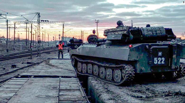 In this photo taken from video provided by the Russian Defense Ministry on Tuesday, Russian armored vehicles are loaded onto railway platforms after the end of military drills. 