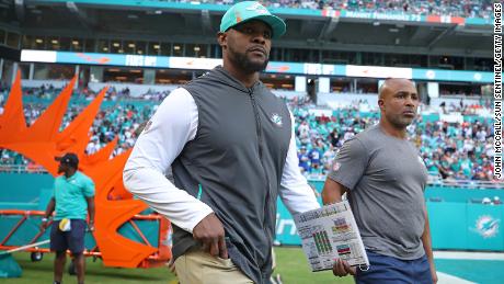 Former Miami Dolphins head coach Brian Flores takes the field for Miami&#39;s game against the New York Giants on Dec. 5, 2021.