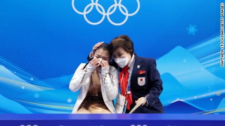 Kaori Sakamoto of Team Japan reacts after hearing her score during the Beijing 2022 Winter Olympics. 