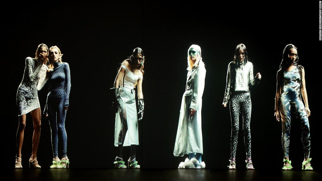 New York Type 7 days current staged with 7-foot-tall holographic merchandise