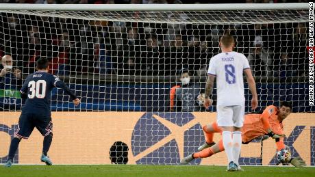 Real Madrid&#39;s goalkeeper Thibaut Courtois stops a penalty-kick by Lionel Messi.