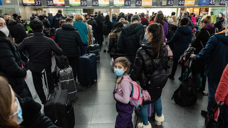 Travelers wait in line to check in to their departing flights on Tuesday, February 15, at the Boryspil International Airport outside Kyiv. US President Joe Biden <a href="https://www.cnn.com/2022/02/10/politics/biden-ukraine-things-could-go-crazy/index.html" target="_blank">has urged Americans in Ukraine to leave the country,</a> warning that "things could go crazy quickly" in the region.