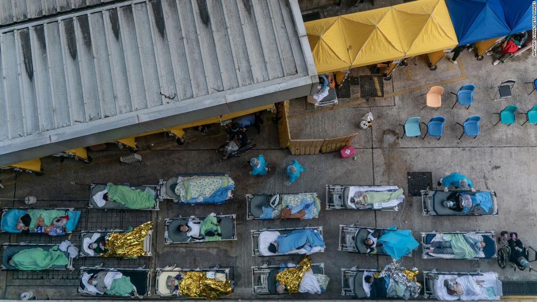 Parking lot turned into outdoor wards as Covid overwhelms hospitals in Hong Kong  – CNN Video