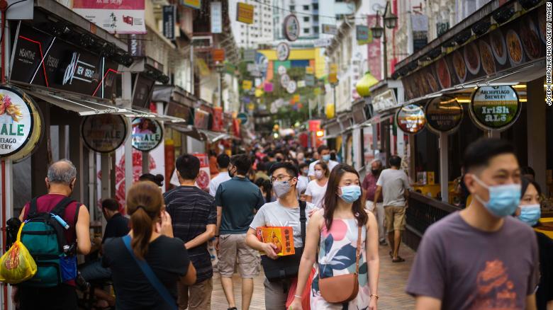 People walk in the Kreta Ayer district of Singapore ahead of the Lunar New Year on January 29.