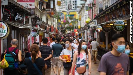 People walk in the Kreta Ayer district of Singapore ahead of the Lunar New Year on January 29.