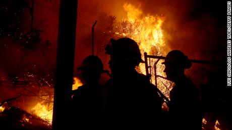 California firefighters are battling wildfires day and night as nearby homes are threatened.