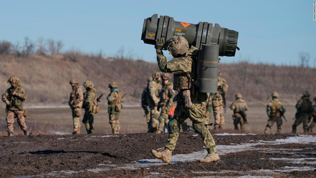 A Ukrainian serviceman carries an anti-tank weapon during an exercise in the Donetsk region of eastern Ukraine on Tuesday, February 15.