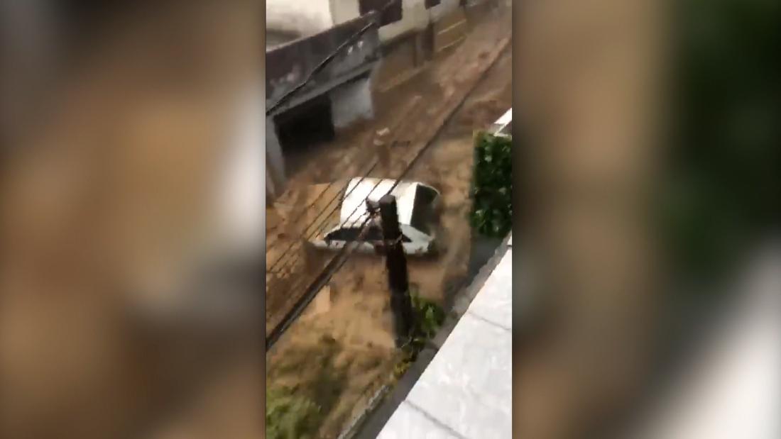 Brazil: Dramatic footage shows deluge carrying car after torrential rain – CNN Video