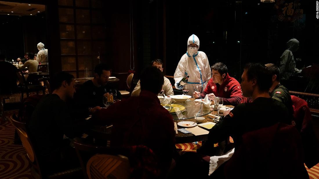 A waitress wearing protective gear serves a table at a hotel restaurant inside the &lt;a href=&quot;https://www.cnn.com/2022/01/21/china/beijing-winter-olympics-covid-quarantine-explained-mic-intl-hnk/index.html&quot; target=&quot;_blank&quot;&gt;Olympic bubble&lt;/a&gt; on February 16. The Beijing Olympic Committee &lt;a href=&quot;https://www.cnn.com/world/live-news/beijing-winter-olympics-02-17-22-spt/h_bc4149580ecbcfd278b4739c74f899a7&quot; target=&quot;_blank&quot;&gt;identified no new Covid-19 cases&lt;/a&gt; among Games-related personnel on Wednesday, it said in a statement. It was the first time no new infections had been detected since the beginning of the Winter Olympics, and it followed a steady decline in cases for the past two weeks.