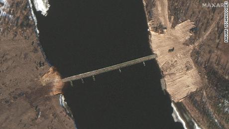 Satellite images taken over the past two days show construction of a new road and a tactical bridge being built over a key river in Belarus less than six kilometers from the Ukrainian border.