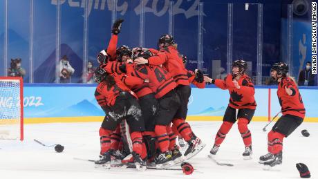 Team Canada celebrates its win over Team USA in the women&#39;s ice hockey gold medal match.