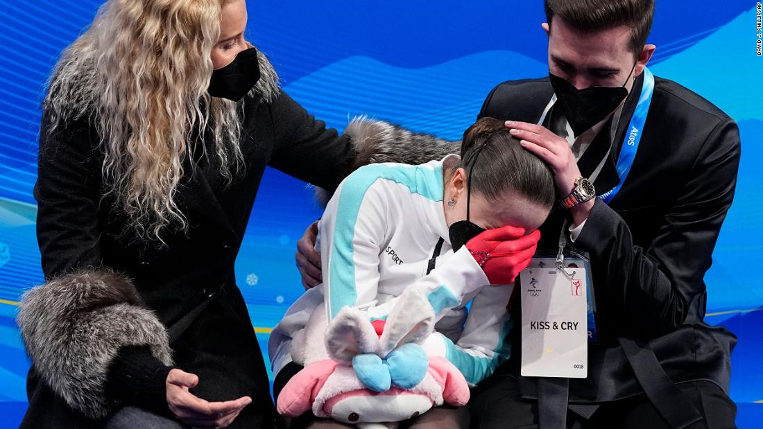 Valieva is consoled after her disastrous free skate.