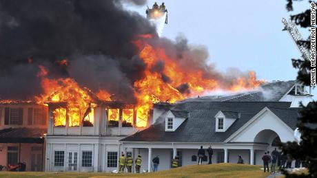 A fire burns at the main building at Oakland Hills Country Club in Bloomfield Township, Michigan, on Thursday.