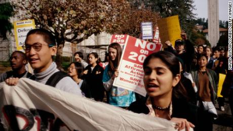 Students protest outside the meeting of the University of California&#39;s Board of Regents in favor of affirmative action. 