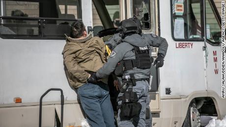 Canada freedom convoy: Covid-19 protesters and police clash in Ottawa in freezing conditions