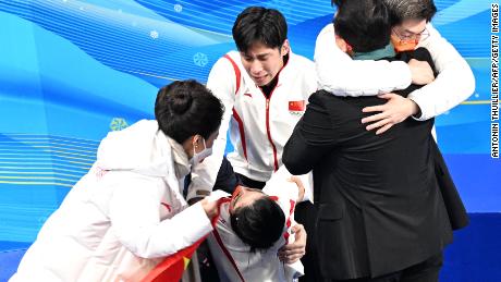 China&#39;s Sui Wenjing, second left, reacts to winning the pairs skating free skating gold medal with China&#39;s Han Cong during the Beijing 2022 Winter Olympic Games at the Capital Indoor Stadium in Beijing on February 19, 2022. 