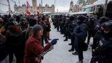 Protesters and police face each other as police move in &lt;a href=&quot;https://www.cnn.com/2022/02/19/americas/canada-trucker-protest-covid-saturday/index.html&quot; target=&quot;_blank&quot;&gt;to clear downtown Ottawa&lt;/a&gt; of protesters on Saturday, February 19.